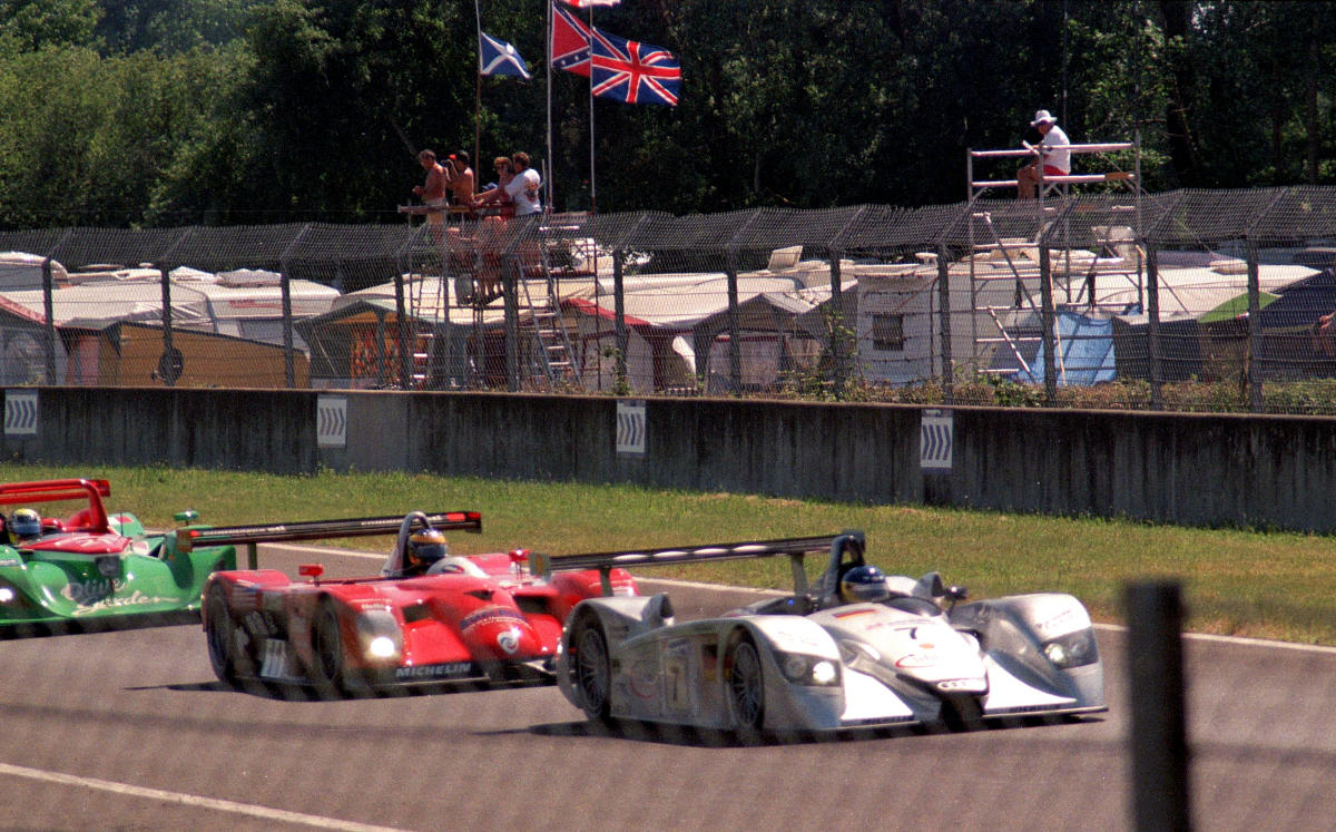 Audi R8 leads Panoz LMP-1 Roadster S & Lola B2K heading for Ford Chicane (52533722744).jpg