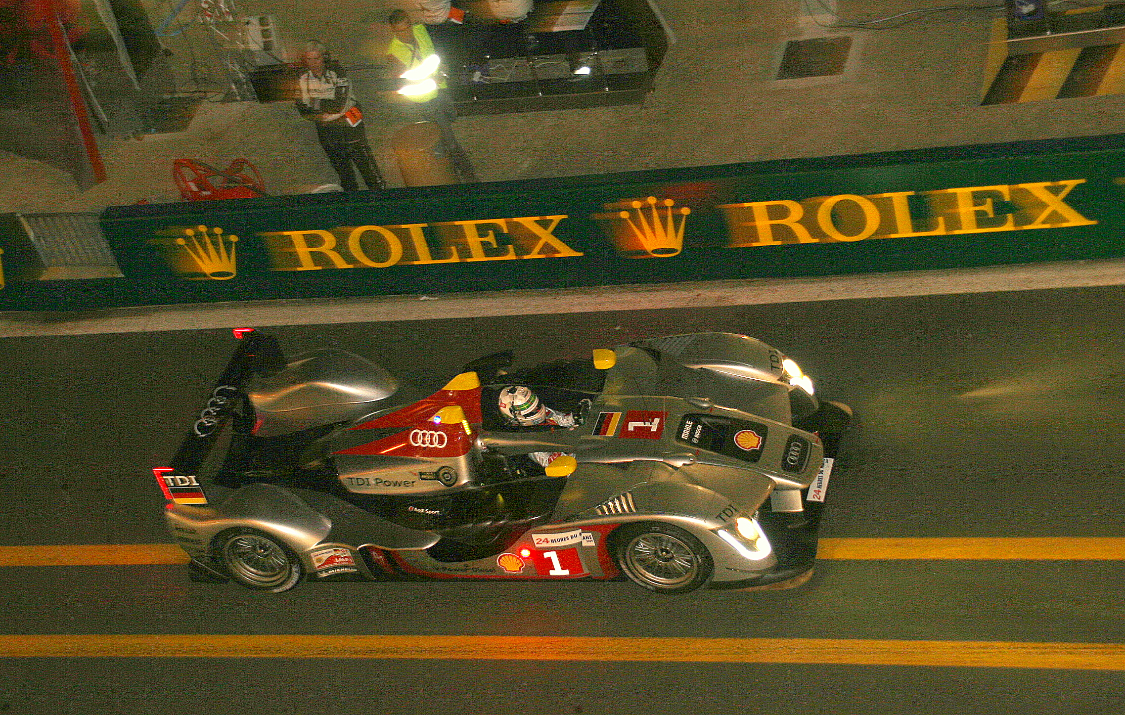Audi R15 TDI - Rinaldo Capello, Tom Kristensen & Allan McNish in the pit lane at the 2009 Le Mans (55113629806).jpg
